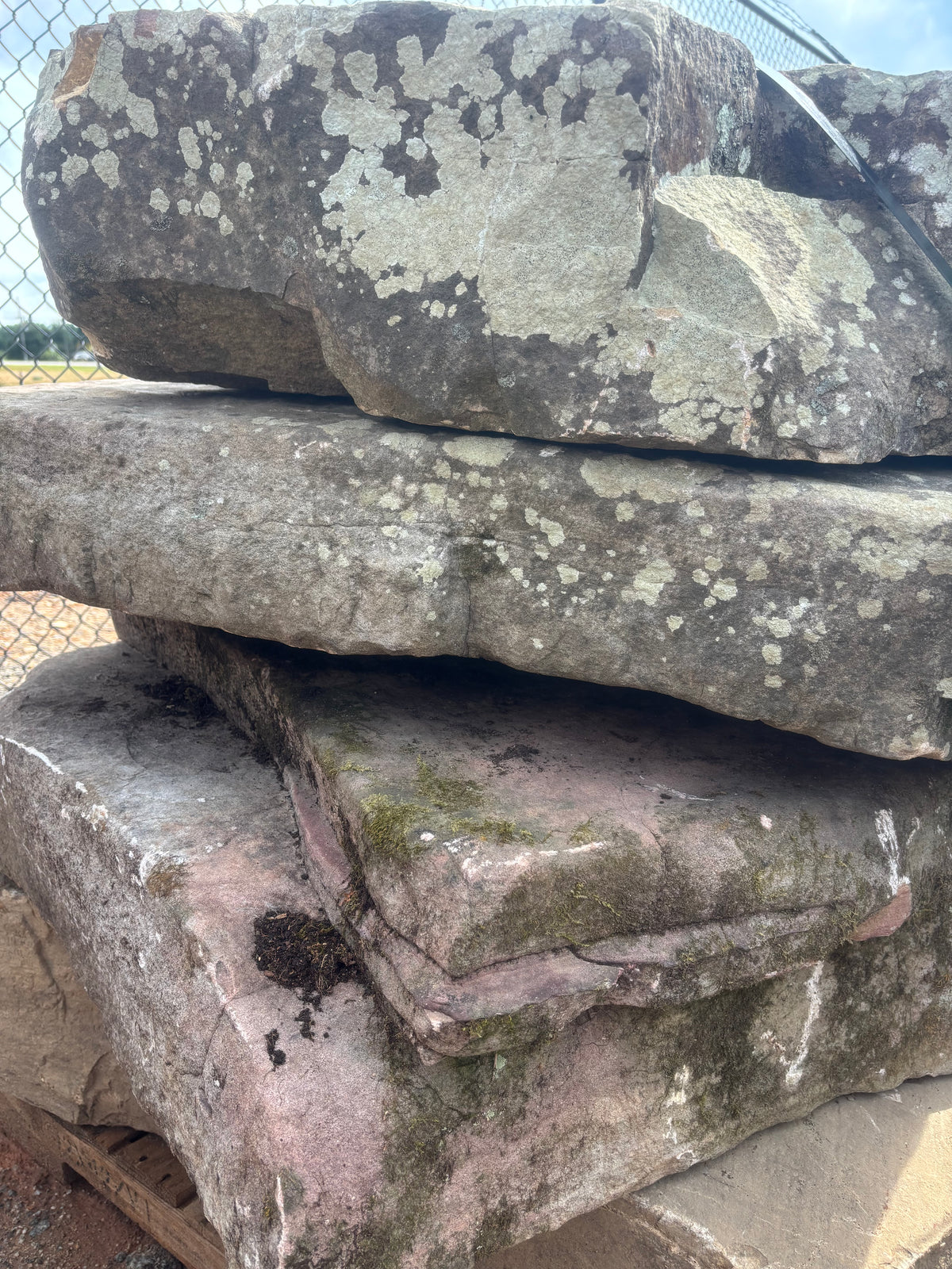 Natural fieldstone steppers stacked on a pallet at 9 Oak in Jenkinsburg Georgia