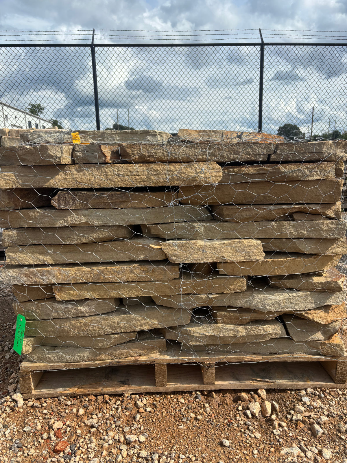 Two to two and a half inch brown flagstone stacked on a pallet at 9 Oak in Jenkinsburg Georgia