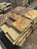 Natural brown capstone pieces stacked at 9 Oak in Jenkinsburg Georgia