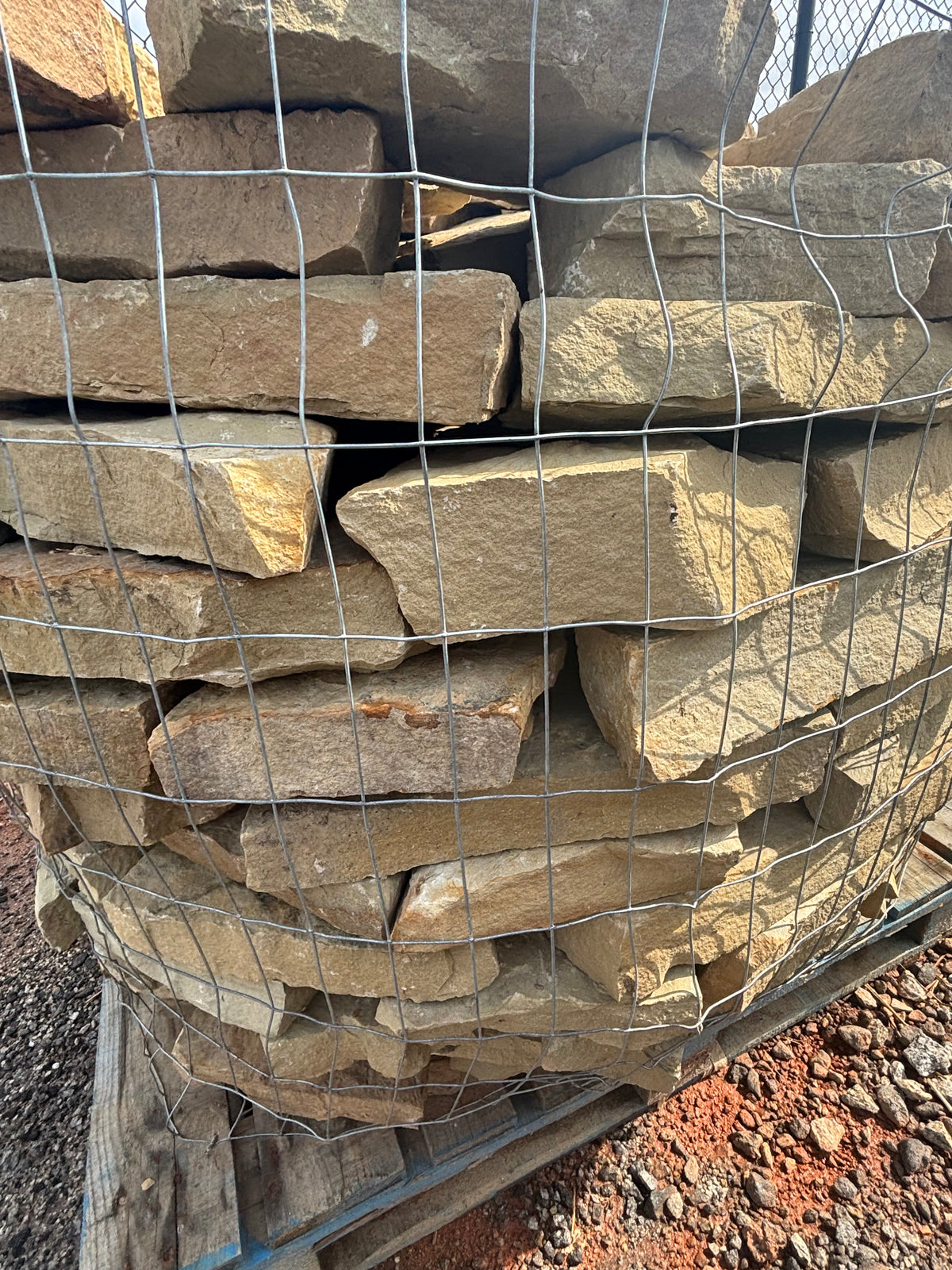 Brown quarry rock stacked on a pallet at 9 Oak in Jenkinsburg Georgia