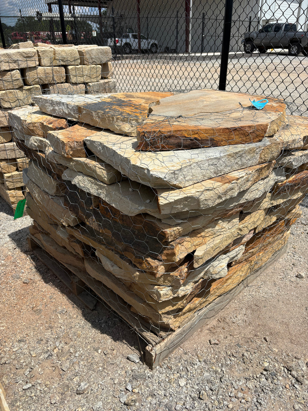 Two to two and a half inch brown flagstone stacked on a pallet at 9 Oak in Jenkinsburg Georgia