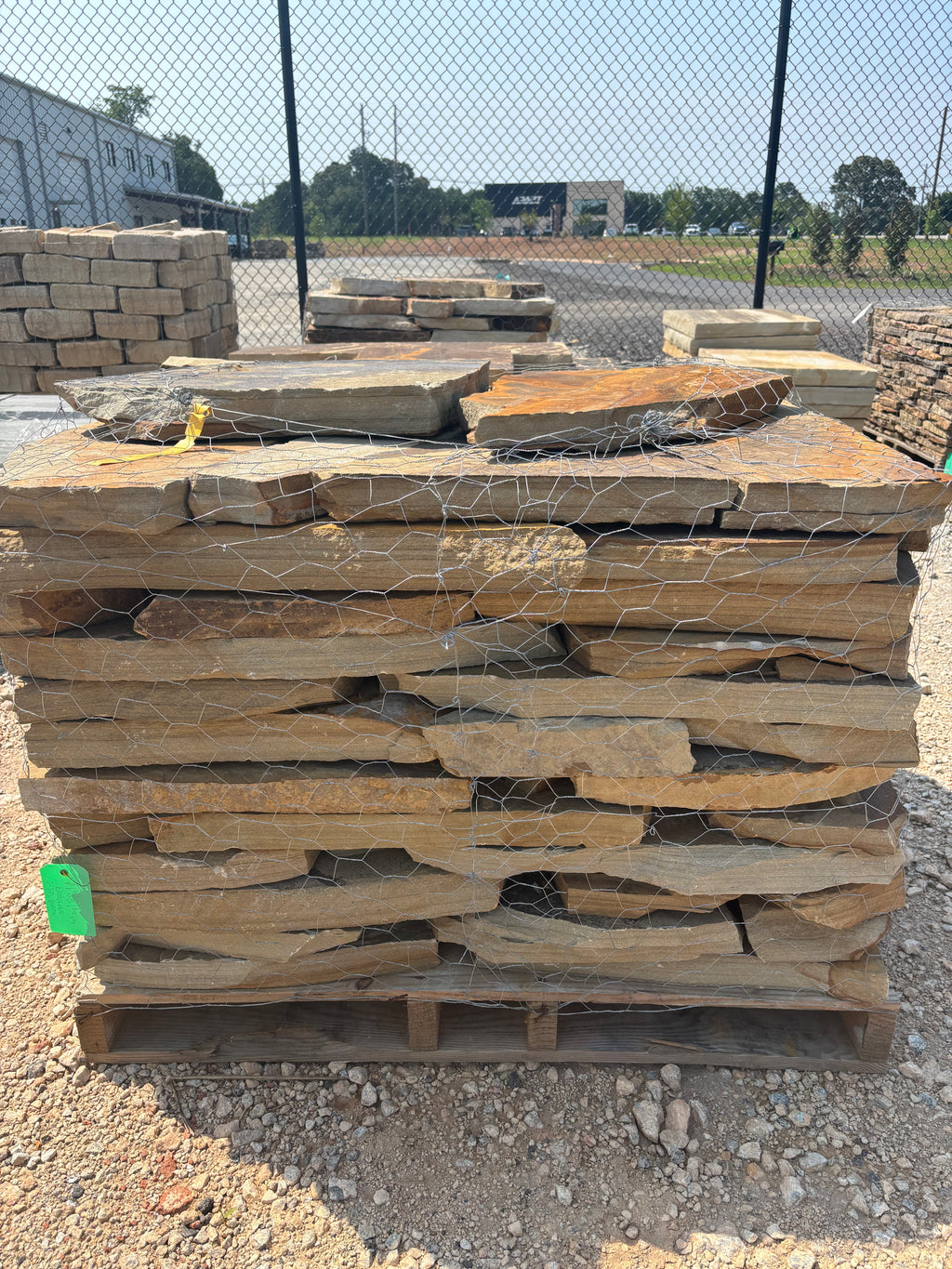 2.5 inch brown flagstone stacked on a pallet at 9 Oak in Jenkinsburg Georgia